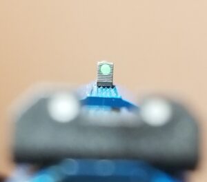 Fiber optic front sight on a three dot sight setup